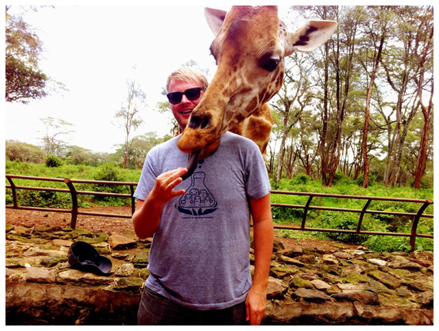 Andrew Hyde with a Giraffe in Nairobi
